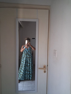 One-piece jumpsuit like new, turquoise background