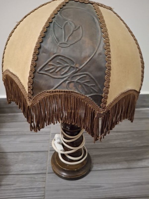 Vintage table lamp with wooden base and embossed fringed shade