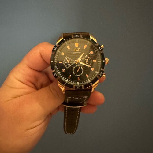 Wristwatch new with leather strap and white stitching