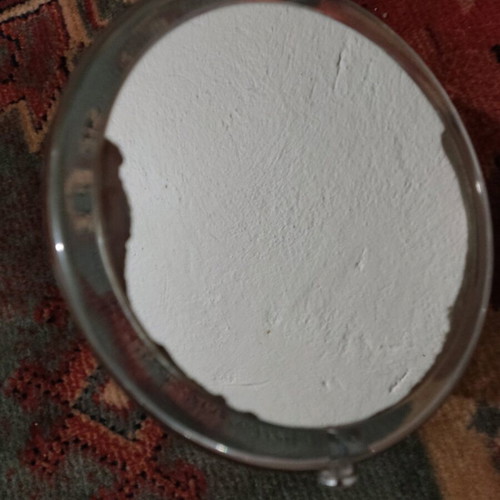 Small mirror used with magnifying side