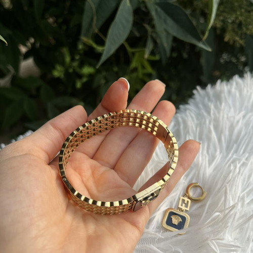 Princess stainless steel bracelet and earrings set like new, black and gold