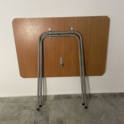Folding table used with metal base and brown melamine top