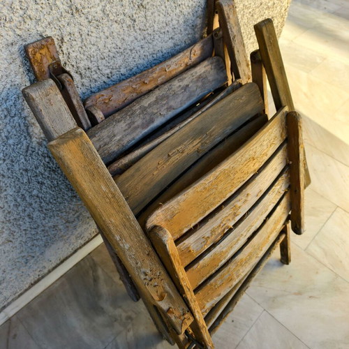 Wooden outdoor chairs used, set of 5, one with broken plank
