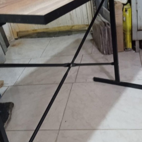 Metal table with MDF surface.
