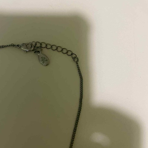 Pendant used with silver chain, pearls and retro bow