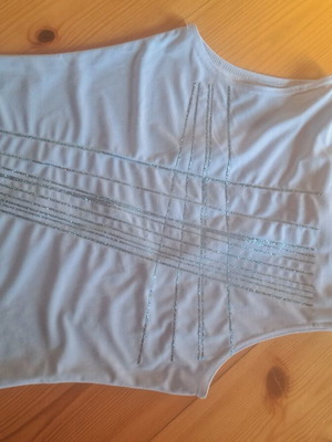 Blue sleeveless top used with blue stripes and rhinestones