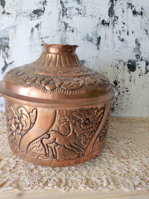 Copper Gianniotiki carved pot with bronze feet used