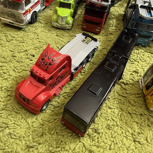 Large collection of toy trucks with accessories