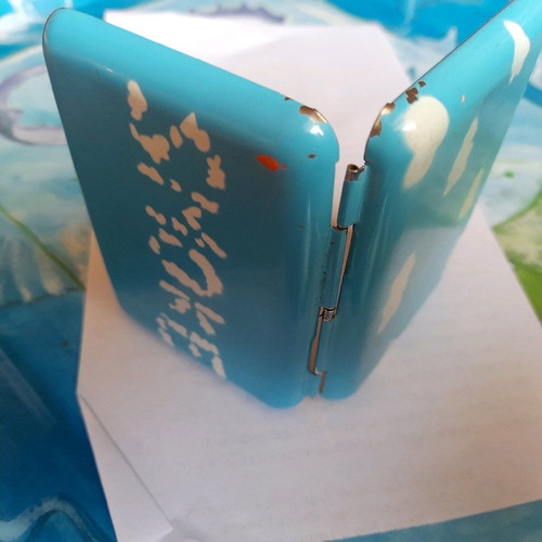 Tobacco case used, sky blue with white smoke clouds
