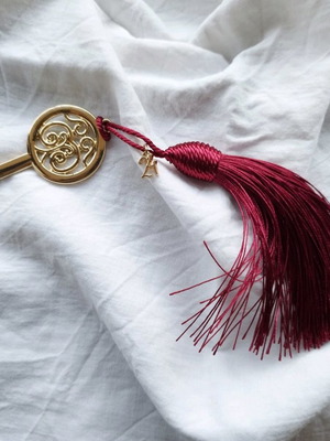 Handmade lucky charm with metal elements and tassel made to order