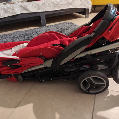 Kiddo Smart Deluxe stroller used with footmuff and changing bag, red
