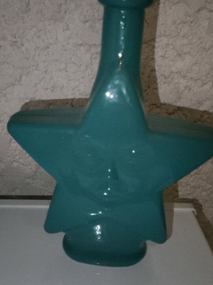 Star-shaped bottle with cork like new