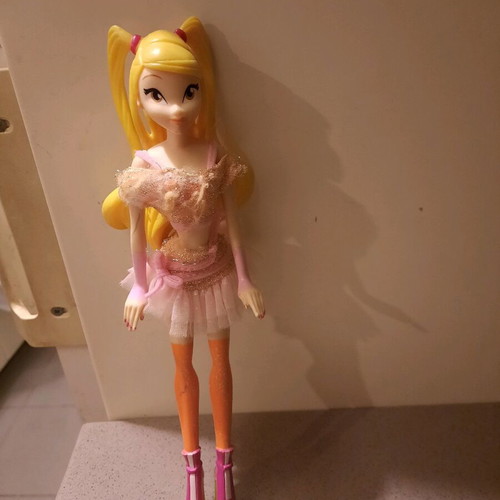 Winx doll used with slightly torn top