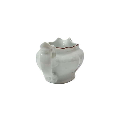 Vintage porcelain sauceboat with floral motif like new