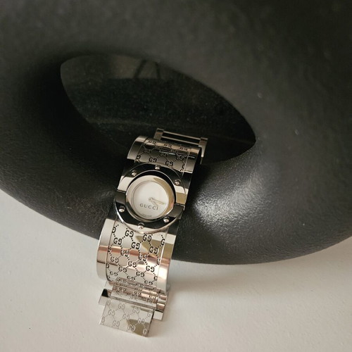 Gucci women's silver round bracelet-style watch like new