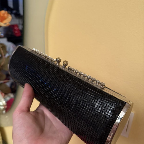 Black evening clutch bag with metallic details