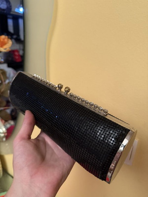 Black evening clutch bag with metallic details