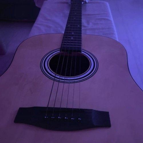 Granite acoustic guitar like new with built-in pick holder