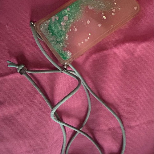 iPhone X/XS phone case used with lanyard and glitter