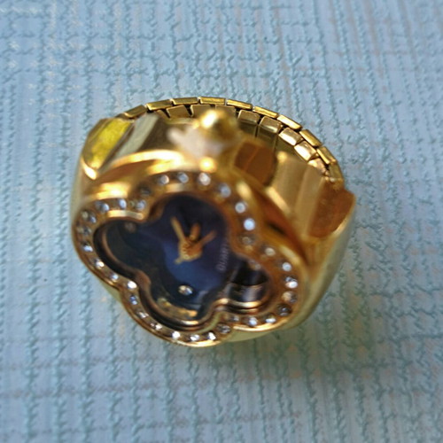 Four-leaf ring like new with quartz watch, blue dial and crystals