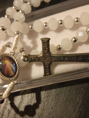 Old rosary in plexiglass case new