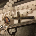 Old rosary in plexiglass case new