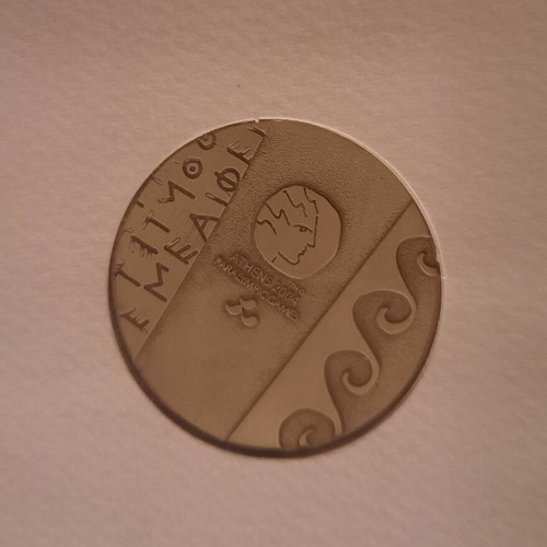 Medal in folder from Athens 2004 Paralympic Games like new