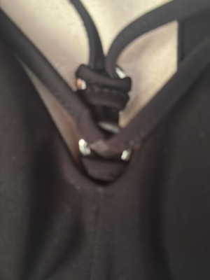 Black elastic top with decorative bust rings used