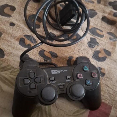 Sony PlayStation 2 console with 2 controllers, memory card and 5 games