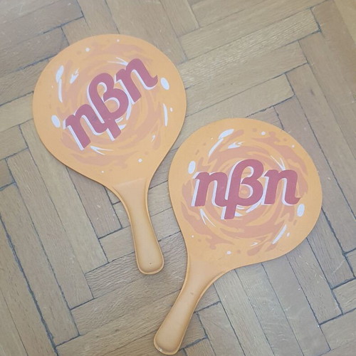 Wooden rounded beach paddles, orange