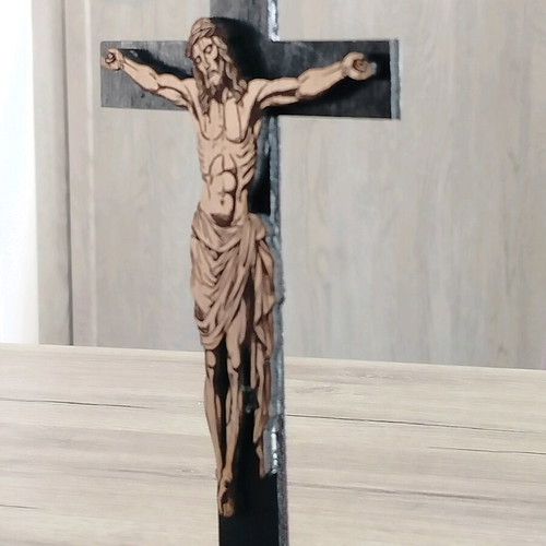 Handmade cross with embossed Jesus figure on laser cut wood