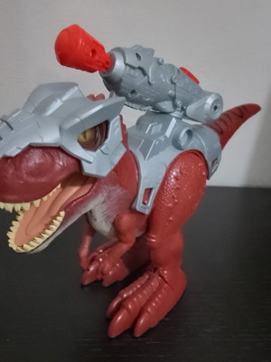 Dinosaur toy walking with sounds and arrow launcher like new