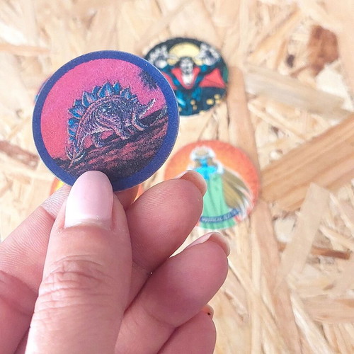 Set of 5 vintage collectible pogs from Spiderman, Yu Gi Oh and dinosaur collections