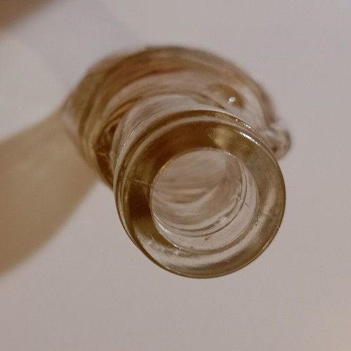 Glass bottle in fish shape used