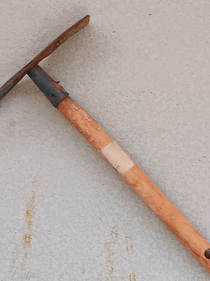 Garden hoe used with wooden handle and double head
