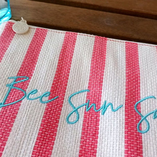 Summer toiletry bag used striped with embroidered Bee Sun Safe phrase