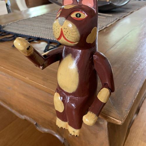 Wooden sitting cat with movable arms, like new, ~20 cm