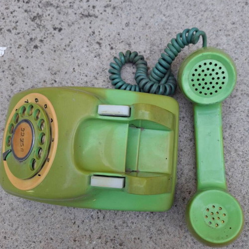 Vintage green rotary dial telephone used