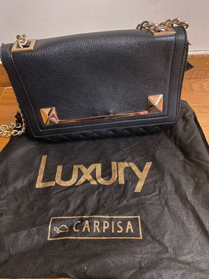 Black quilted shoulder bag used with gold chain