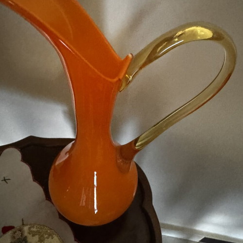 Vintage orange pitcher with slight handle defect