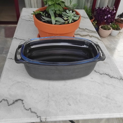 Glass Pyrex and cast iron pot used with surface wear