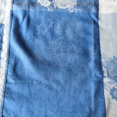 Aegean blue cotton tablecloth with floral woven patterns and lace trim