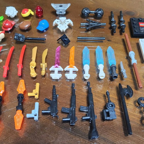 Lego accessory pack used with swords, weapons, hats and armor