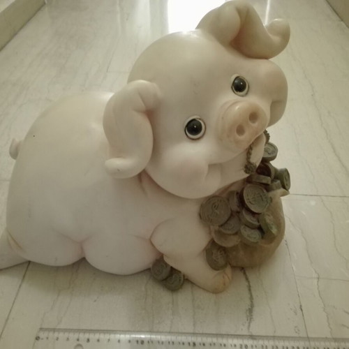 Piggy bank vintage used with gold coins