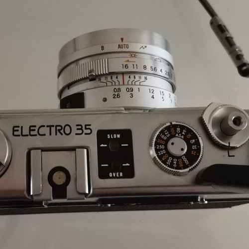 Yashica GSN Electro 35 camera used with Yashinon DX 45mm f/1.7 lens, case, and 2 flashes