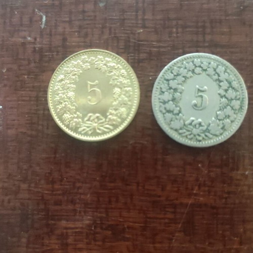 Swiss coins like new, five-cent and 20 cent pieces