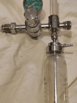 Oxygen Flow Regulator with Sphygmomanometer used, humidifier bottle