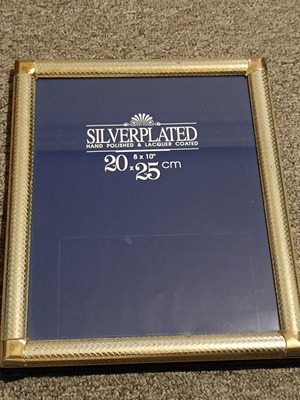 Silverplated photo frame 20x25 cm used with embossed design and wear