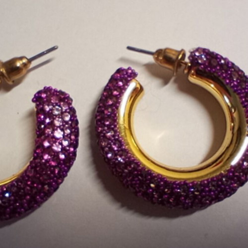 Chunky gold hoop earrings with purple rhinestones, used