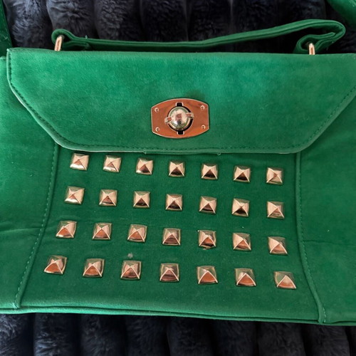 Green suede crossbody bag used with gold details